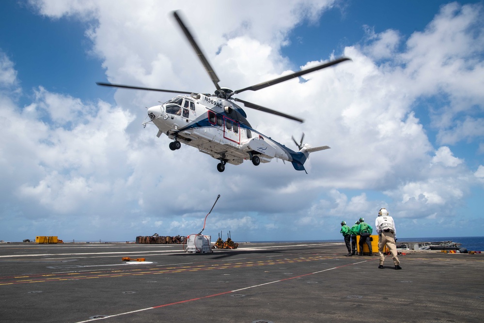 USS Ronald Reagan (CVN 76) conducts a fueling-at-sea and replenishment-at-sea with USNS Rappahannock (T-AO 204) and USNS Cesar Chavez (T-AKE-14)