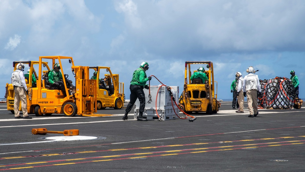 USS Ronald Reagan (CVN 76) conducts a fueling-at-sea and replenishment-at-sea with USNS Rappahannock (T-AO 204) and USNS Cesar Chavez (T-AKE-14)