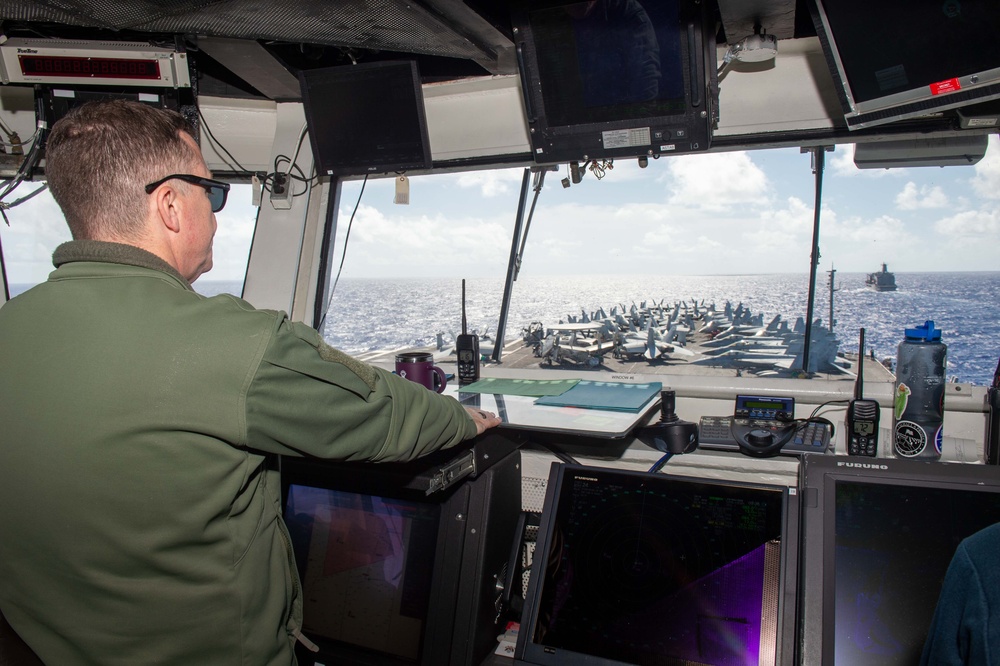 USS Ronald Reagan (CVN 76) conducts a fueling-at-sea and replenishment-at-sea with USNS Rappahannock (T-AO 204) and USNS Cesar Chavez (T-AKE 14)