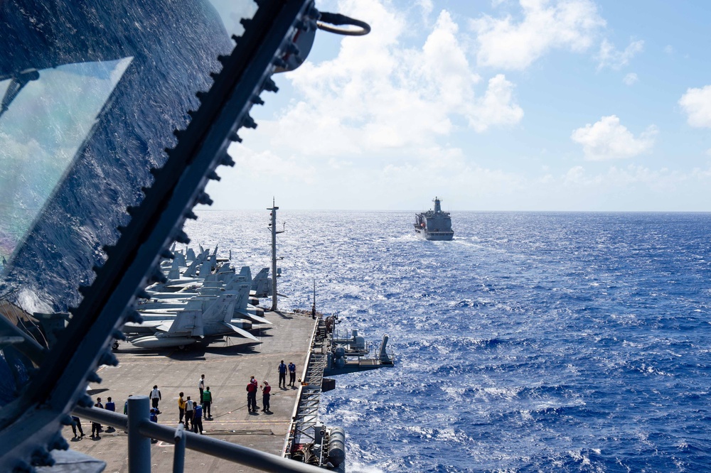 USS Ronald Reagan (CVN 76) conducts a fueling-at-sea and replenishment-at-sea with USNS Rappahannock (T-AO 204) and USNS Cesar Chavez (T-AKE 14)