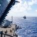 USS Ronald Reagan (CVN 76) conducts a fueling-at-sea and replenishment-at-sea with USNS Rappahannock (T-AO 204) and USNS Cesar Chavez (T-AKE 14)