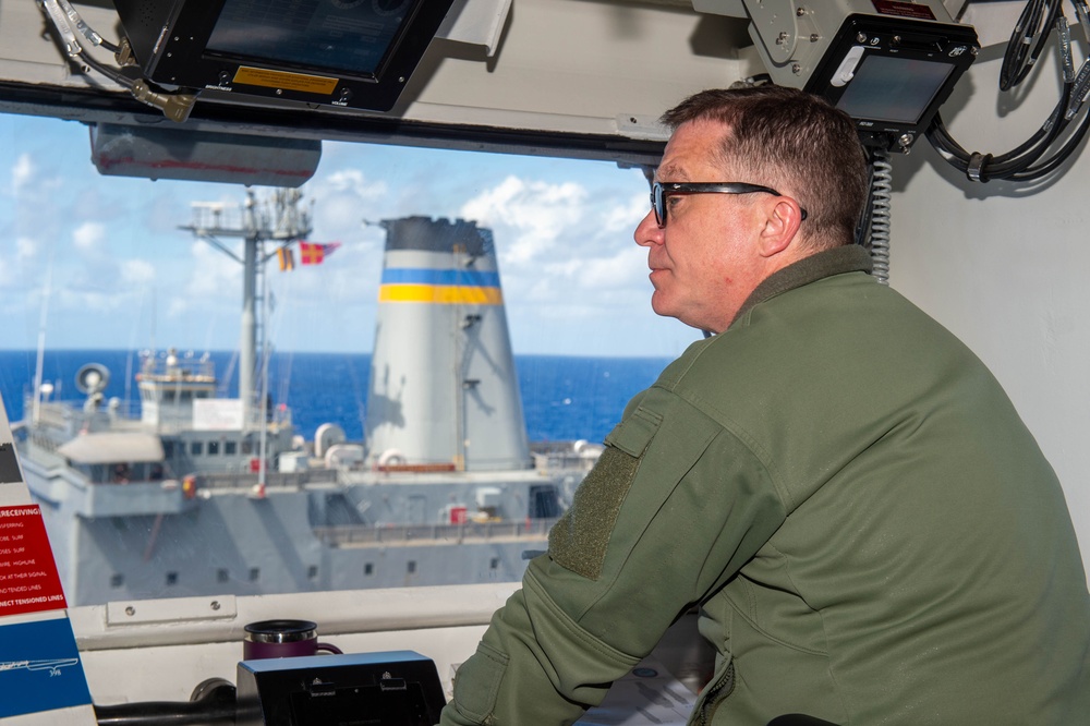 USS Ronald Reagan (CVN 76) conducts a fueling-at-sea and replenishment-at-sea with USNS Rappahannock (T-AO 204) and USNS Cesar Chavez (T-AKE 14)