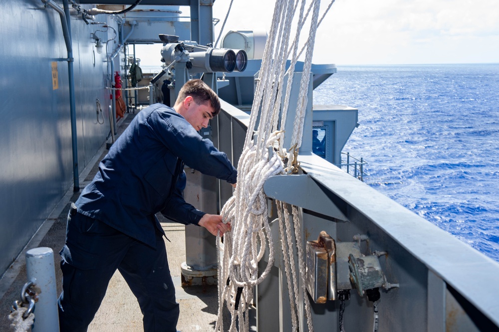 USS Ronald Reagan (CVN 76) conducts a fueling-at-sea and replenishment-at-sea with USNS Rappahannock (T-AO 204) and USNS Cesar Chavez (T-AKE 14)