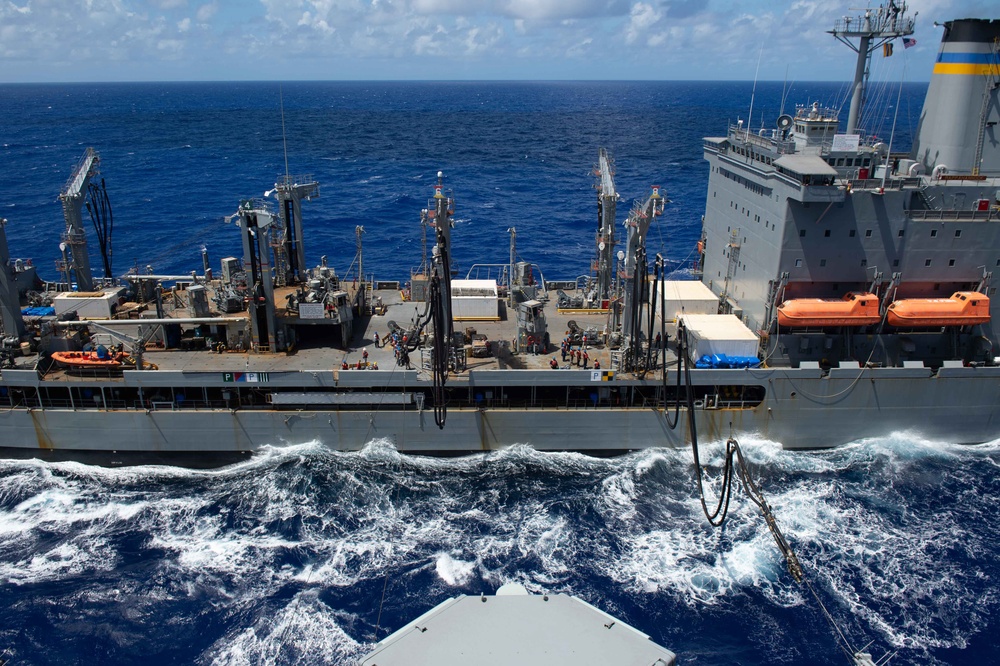 USS Ronald Reagan (CVN 76) conducts a fueling-at-sea and replenishment-at-sea with USNS Rappahannock (T-AO 204) and USNS Cesar Chavez (T-AKE 14)