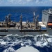 USS Ronald Reagan (CVN 76) conducts a fueling-at-sea and replenishment-at-sea with USNS Rappahannock (T-AO 204) and USNS Cesar Chavez (T-AKE 14)