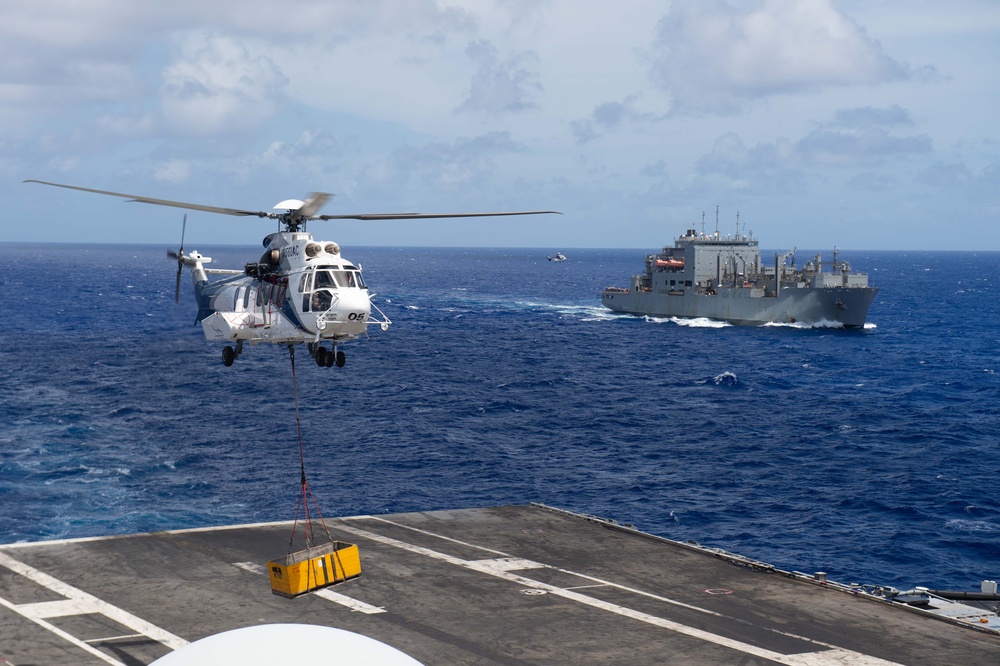 USS Ronald Reagan (CVN 76) conducts a fueling-at-sea and replenishment-at-sea with USNS Rappahannock (T-AO 204) and USNS Cesar Chavez (T-AKE 14)