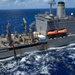 USS Ronald Reagan (CVN 76) conducts a fueling-at-sea and replenishment-at-sea with USNS Rappahannock (T-AO 204) and USNS Cesar Chavez (T-AKE 14)