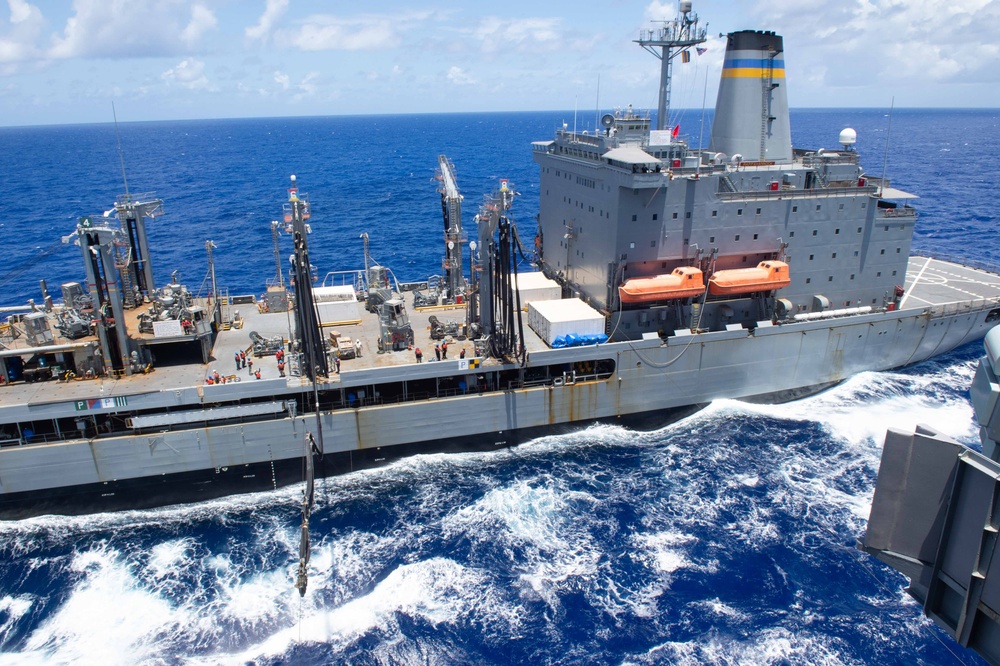 USS Ronald Reagan (CVN 76) conducts a fueling-at-sea and replenishment-at-sea with USNS Rappahannock (T-AO 204) and USNS Cesar Chavez (T-AKE 14)