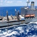 USS Ronald Reagan (CVN 76) conducts a fueling-at-sea and replenishment-at-sea with USNS Rappahannock (T-AO 204) and USNS Cesar Chavez (T-AKE 14)