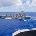 USS Ronald Reagan (CVN 76) conducts a fueling-at-sea and replenishment-at-sea with USNS Rappahannock (T-AO 204) and USNS Cesar Chavez (T-AKE 14)