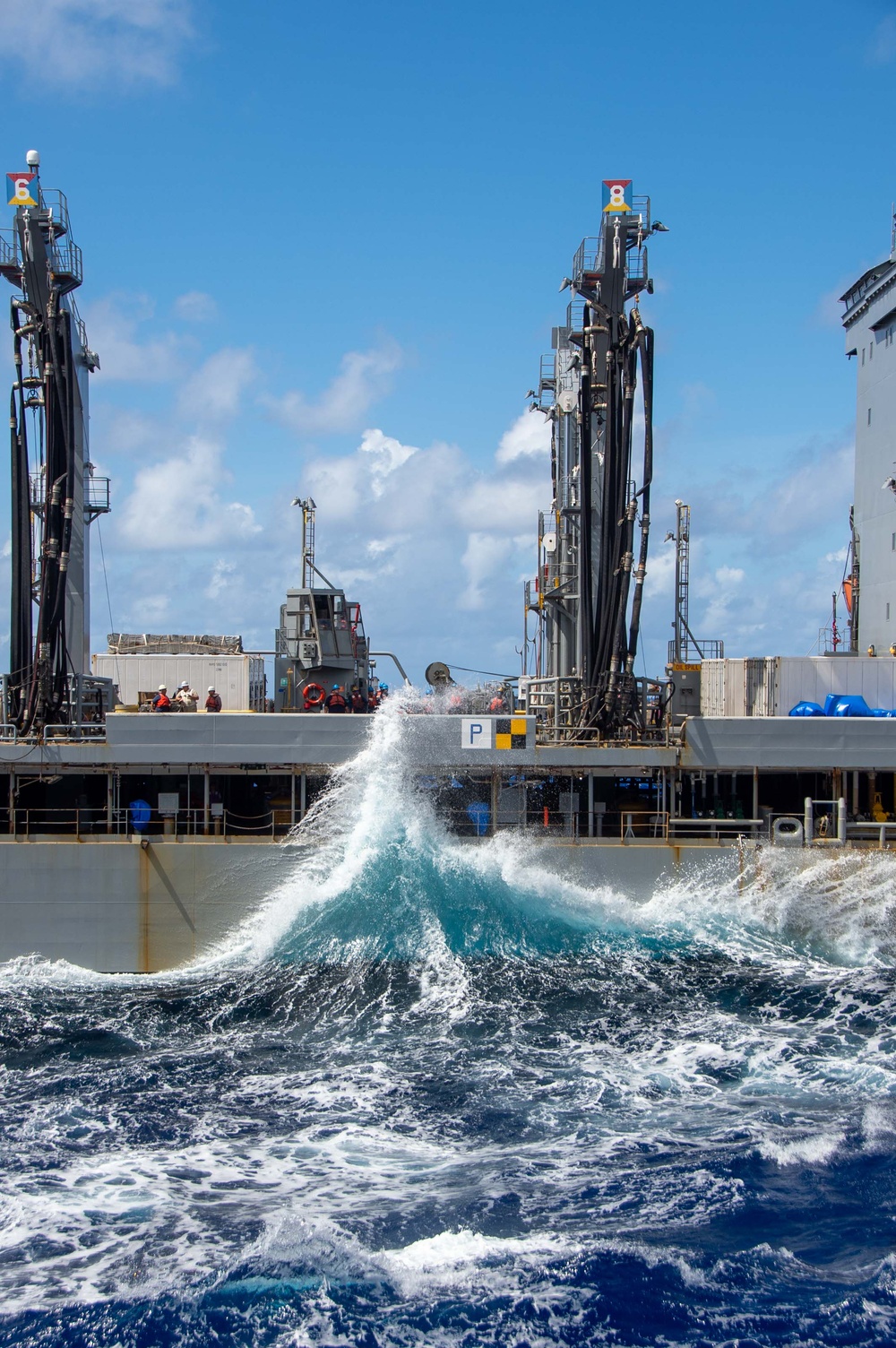 USS Ronald Reagan (CVN 76) conducts fueling-at-sea and replenishment-at-sea with USNS Rappahannock (T-AO 204) and USNS Cesar Chavez (T-AKE 14)