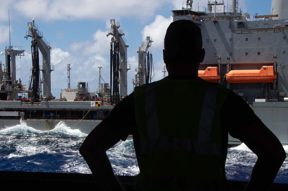 USS Ronald Reagan (CVN 76) conducts fueling-at-sea and replenishment-at-sea with USNS Rappahannock (T-AO 204) and USNS Cesar Chavez (T-AKE 14)