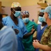 American and Chadian military medical professional works to treat Chadian pediatric patient injuries from June 18 ammunition depot blast