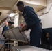 Sailors assigned to the USS America (LHA 6) participate in cargo on load