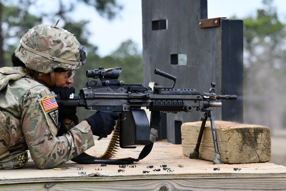 Combat medics use the M249 light machine gun during a field observational assessment