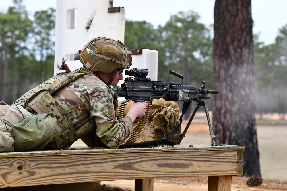 Combat medics use the M249 light machine gun during a field observational assessment