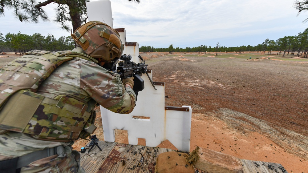 Combat medics use the M249 light machine gun during a field observational assessment