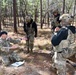 Combat medics use the M249 light machine gun during a field observational assessment