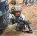 Combat medics use the M249 light machine gun during a field observational assessment