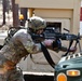 Combat medics use the M249 light machine gun during a field observational assessment