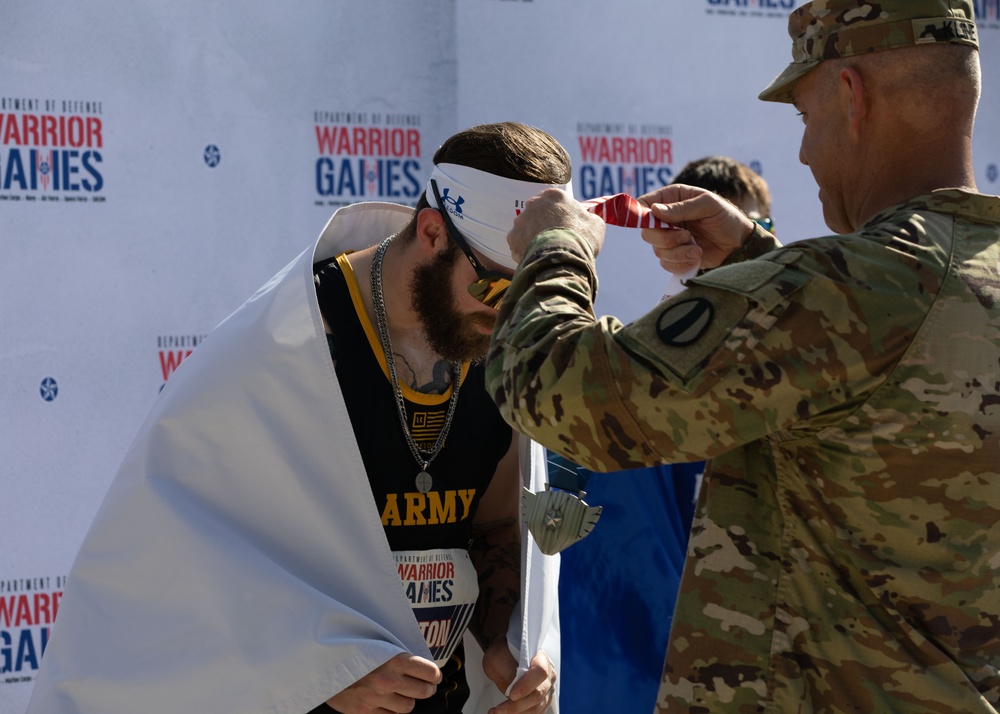 Army Cpl. Patrick Dayton (R) Receives Silver Medal in Track Event During 2024 DoD Warrior Games