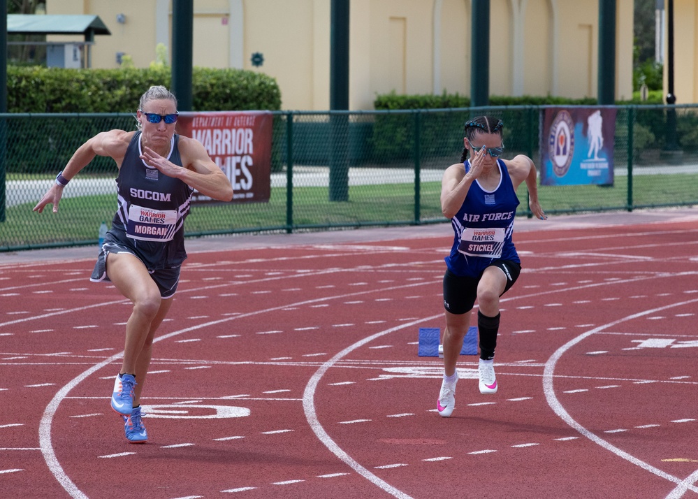 Air Force Maj. Mallory Morgan (R) and Tech. Sgt. Nicole Stickel Compete in Track Event During 2024 DoD Warrior Games