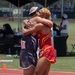 Athletes of Team Marine Corps and Team SOCOM Hug Each Other During 2024 DoD Warrior Games