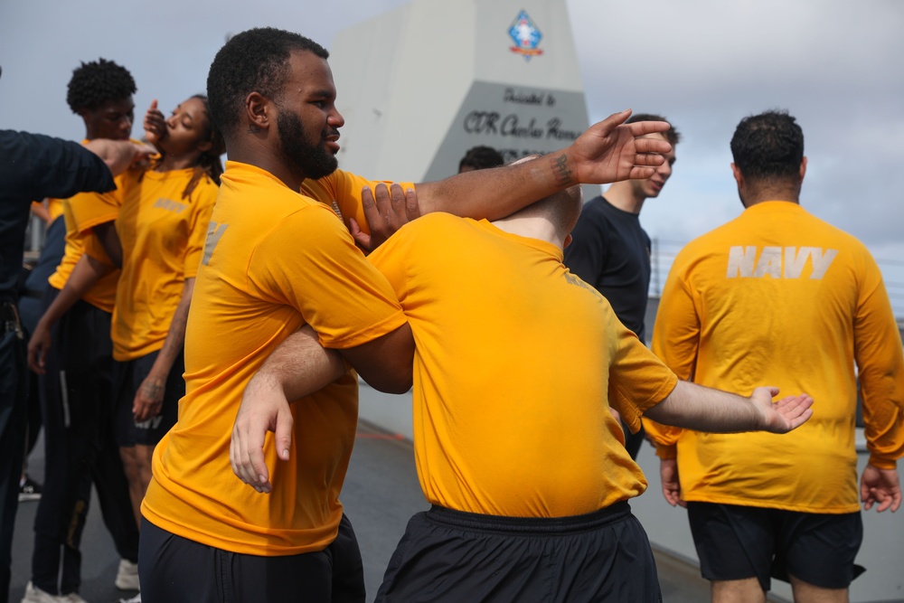 Sailors aboard the USS Howard participate in a security reaction force class in the East China Sea