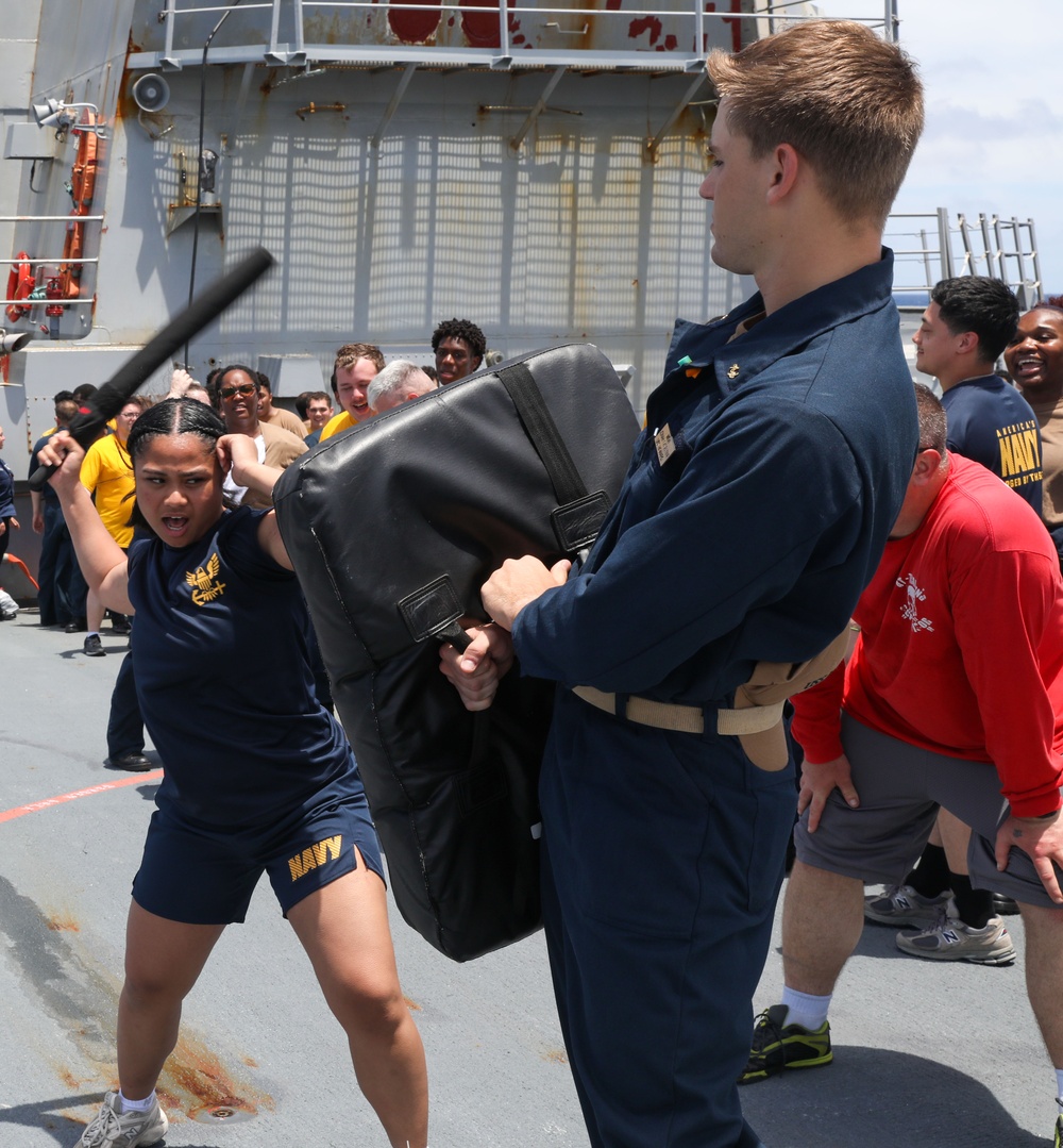 Sailors aboard the USS Howard participate in a sea contamination exercise in the East China Sea