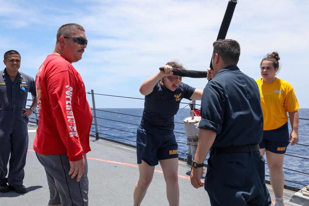 Sailors aboard the USS Howard participate in a sea contamination exercise in the East China Sea