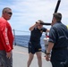 Sailors aboard the USS Howard participate in a sea contamination exercise in the East China Sea