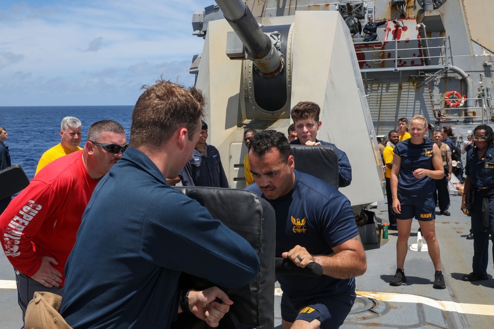 Sailors aboard the USS Howard participate in a sea contamination exercise in the East China Sea