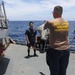 Sailors aboard the USS Howard participate in a sea contamination exercise in the East China Sea