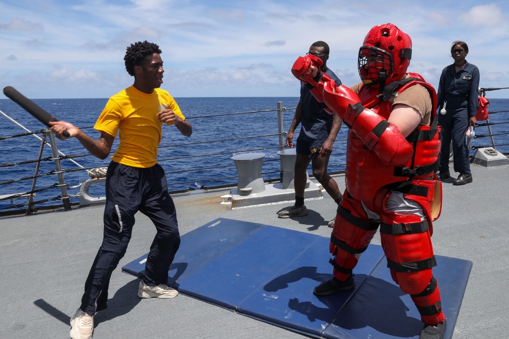 Sailors aboard the USS Howard participate in a sea contamination exercise in the East China Sea