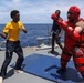 Sailors aboard the USS Howard participate in a sea contamination exercise in the East China Sea