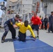 Sailors aboard the USS Howard participate in a sea contamination exercise in the East China Sea