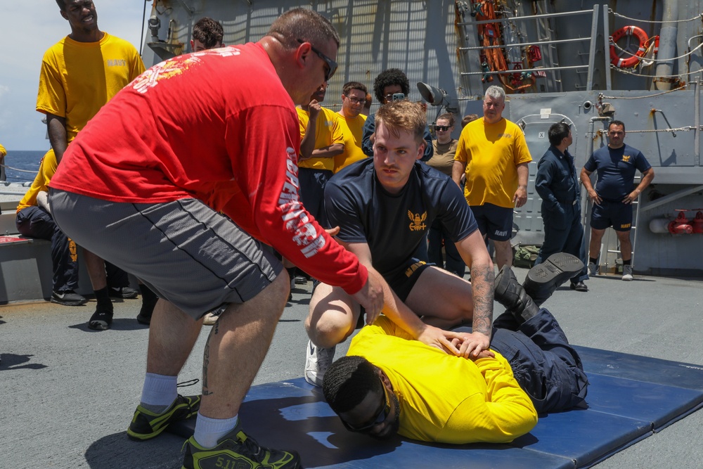 Sailors aboard the USS Howard participate in a sea contamination exercise in the East China Sea