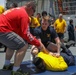 Sailors aboard the USS Howard participate in a sea contamination exercise in the East China Sea