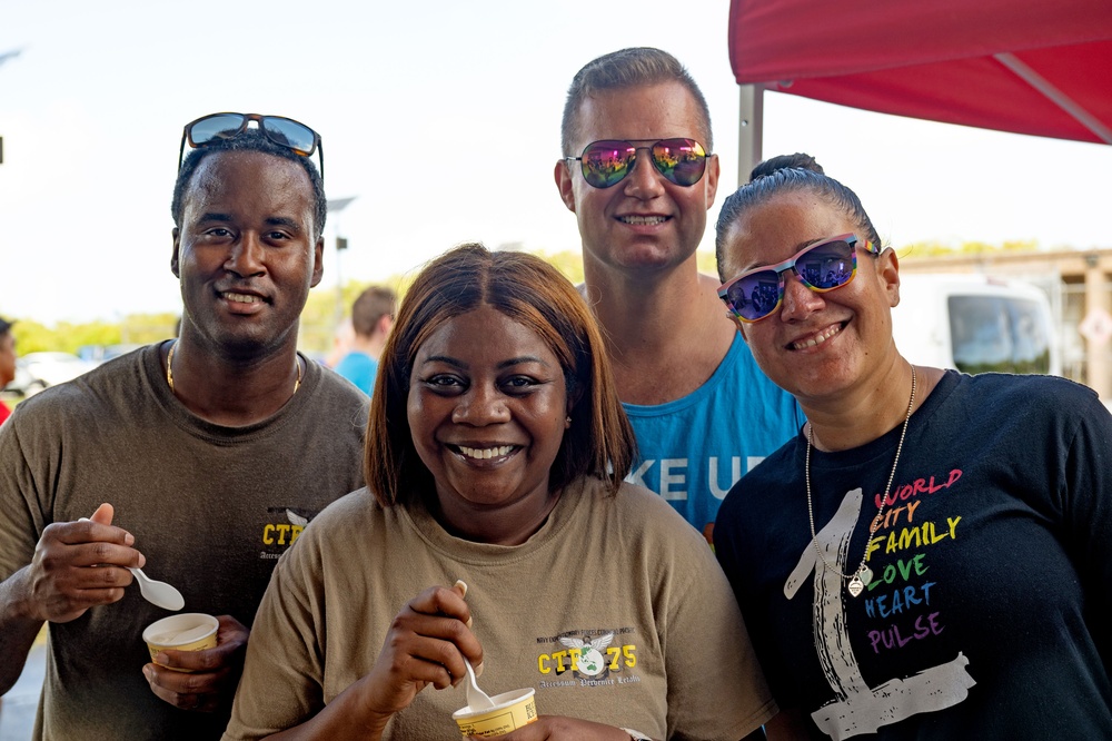 Sailors Pose Together During a Pride Themed Celebration at Camp Covington