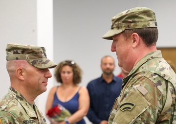 New York Army National Guard Col. Marshall Hunt pins new rank onto Command Sergeant Major Michael Richardson