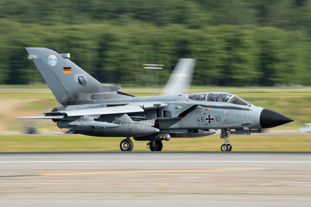 USAF F-22 Raptors and German Air Force PA-200 Tornados train at JBER