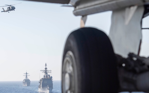 USS Dwight D. Eisenhower (CVN 69) Conducts PhotoX With USS Wasp