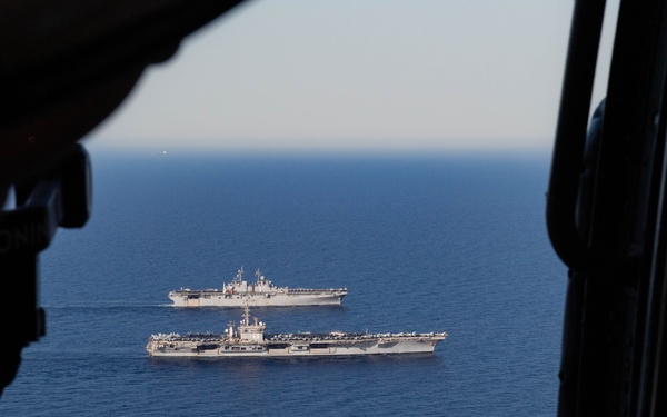USS Dwight D. Eisenhower (CVN 69) Conducts PhotoX With USS Wasp