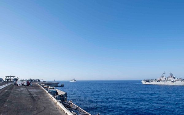 USS Dwight D. Eisenhower (CVN 69) Conducts PhotoX With USS Wasp