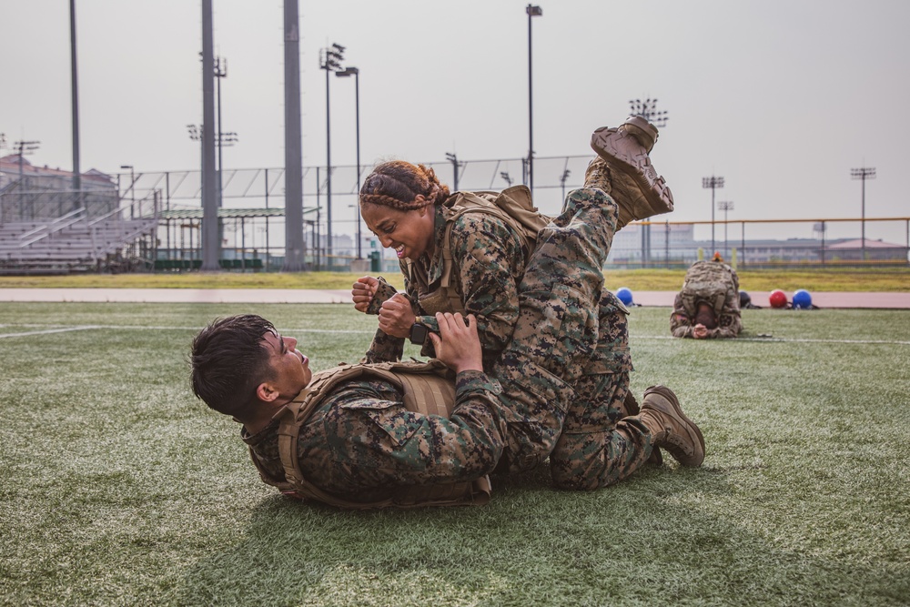 MARFORK Marines participate in a MCMAP MAI Course