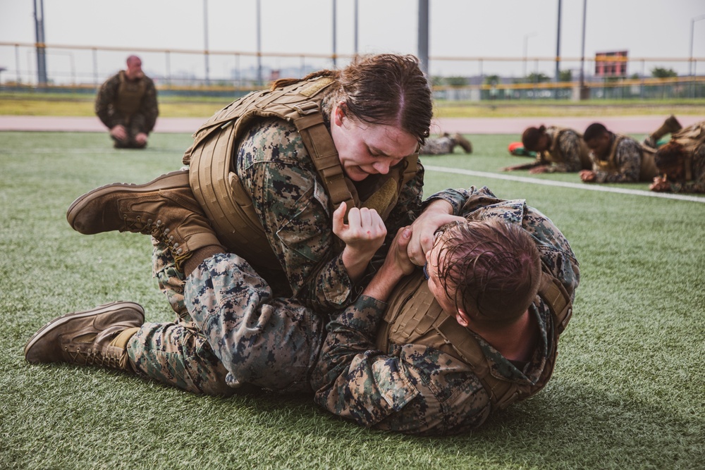 MARFORK Marines participate in a MCMAP MAI Course