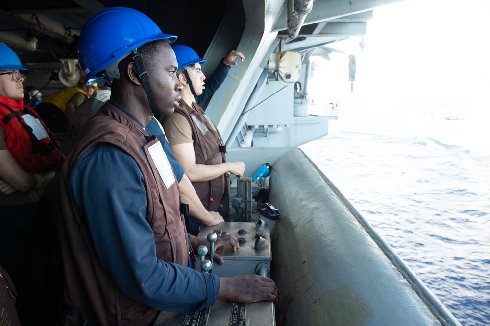 USS Ronald Reagan (CVN 76) conducts fueling-at-sea with USS Robert Smalls (CG 62)