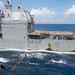 USS Ronald Reagan (CVN 76) conducts fueling-at-sea with USS Robert Smalls (CG 62)
