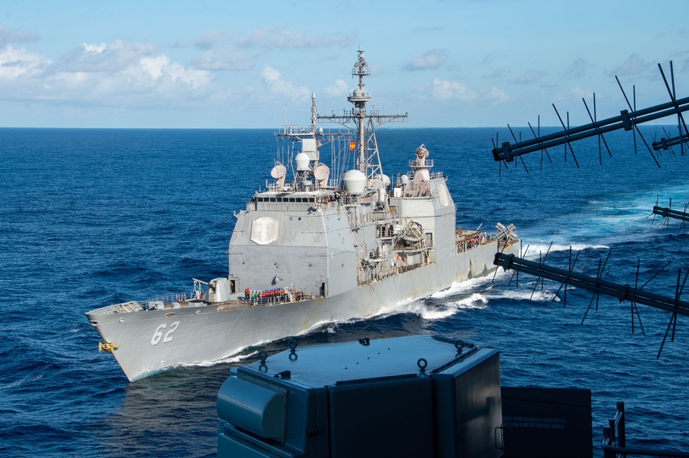 USS Ronald Reagan (CVN 76) conducts fueling-at-sea with USS Robert Smalls (CG 62)