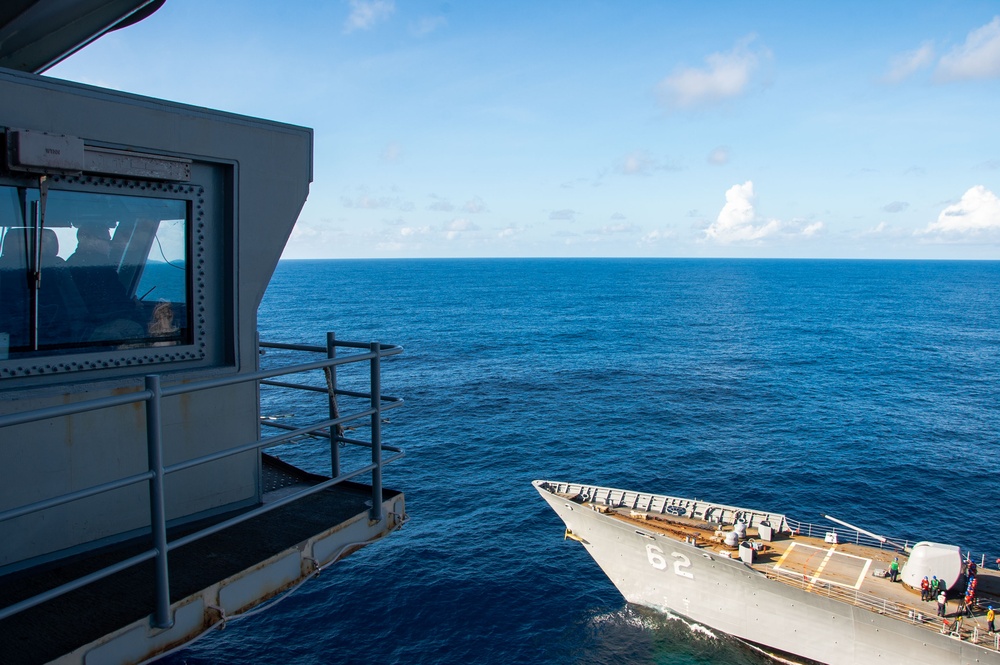 USS Ronald Reagan (CVN 76) conducts fueling-at-sea with USS Robert Smalls (CG 62)